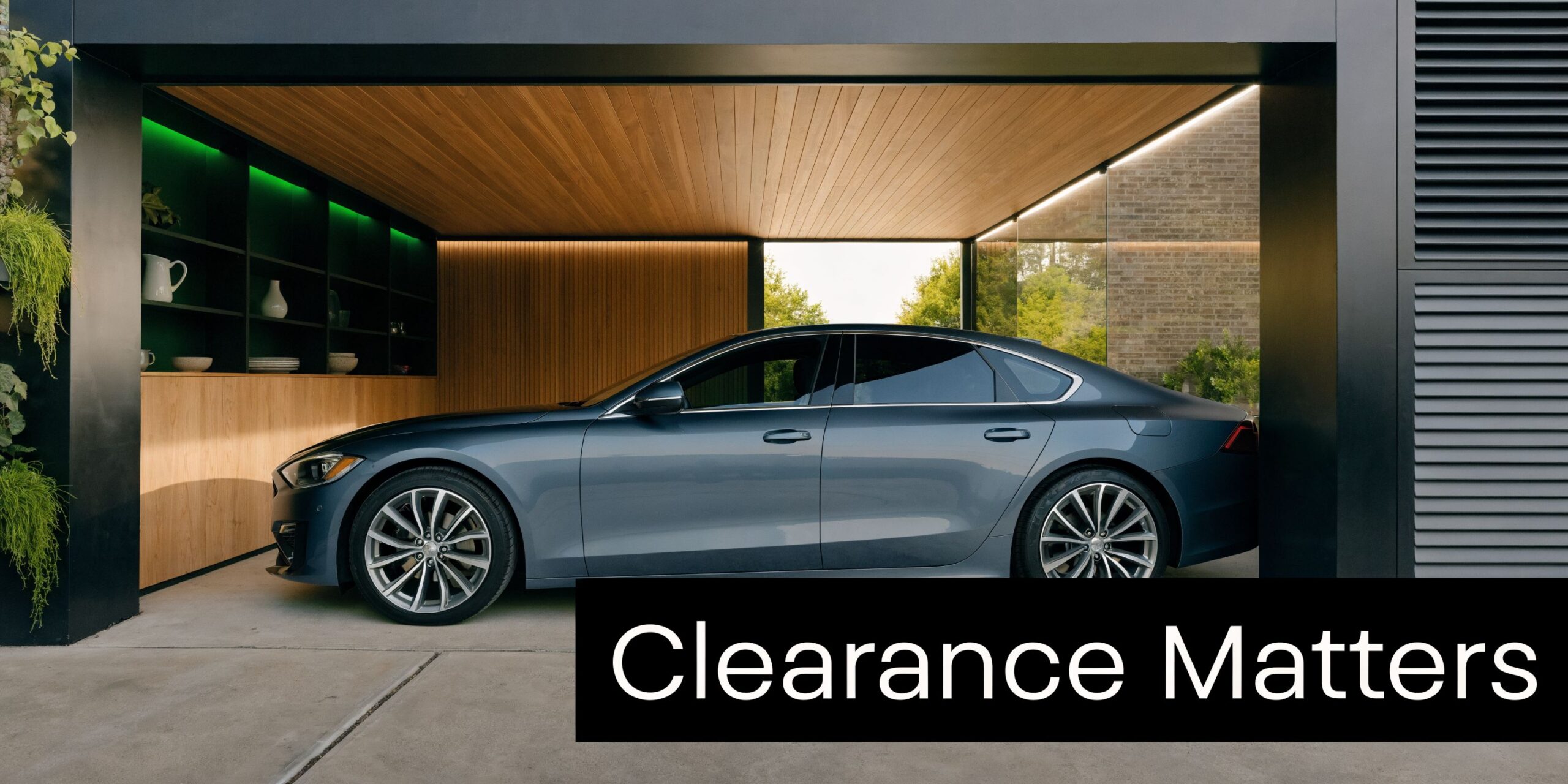 How Big Garage Should You Build? PA & MD Guide 3 A sleek dark blue luxury sedan parked inside a modern minimalist garage with wood paneled ceiling.
