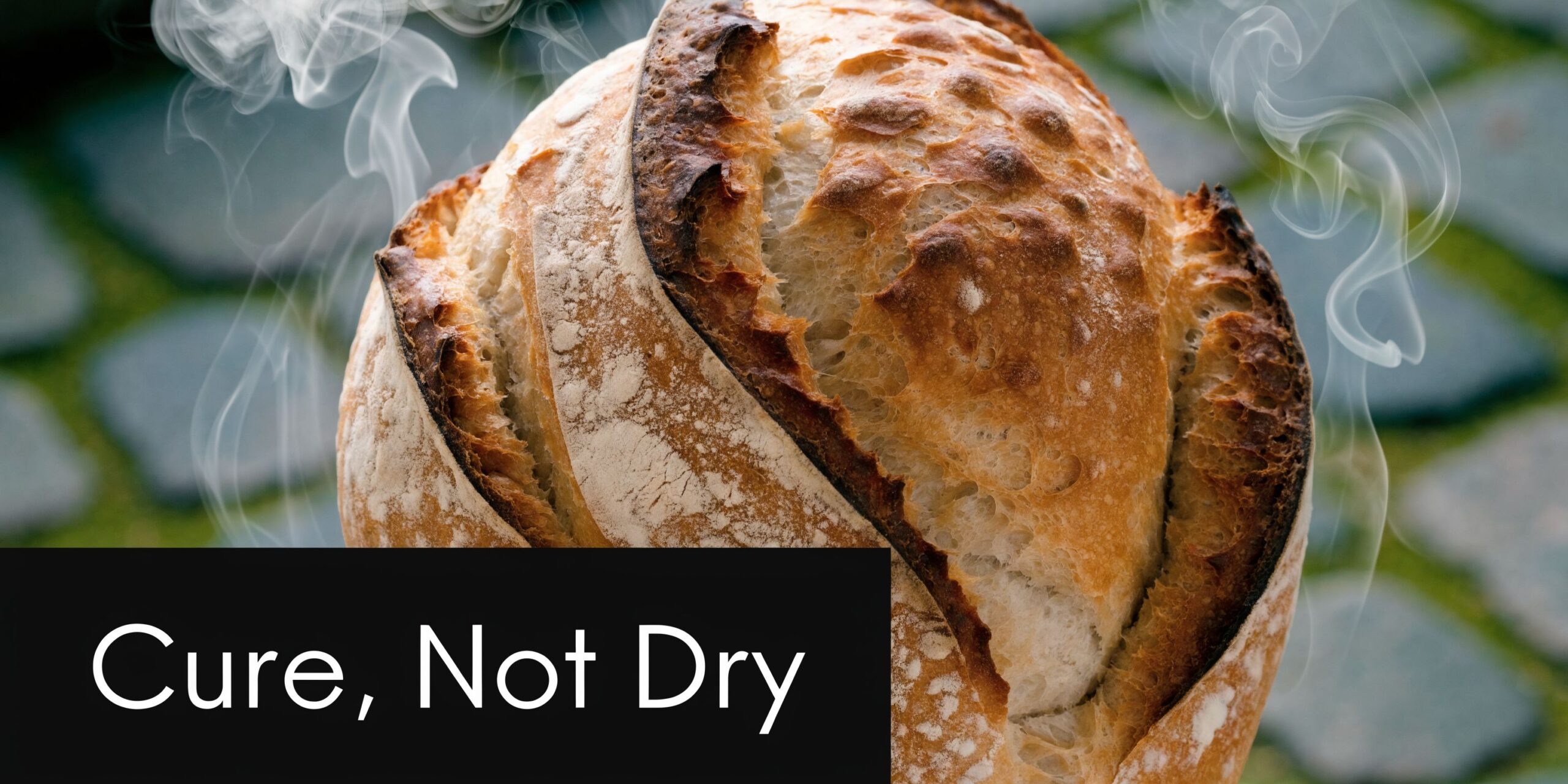 How Long Does a Concrete Slab Take to Cure? 2 A warm loaf of sourdough bread with steam rising against a stone background, captioned Cure, Not Dry.