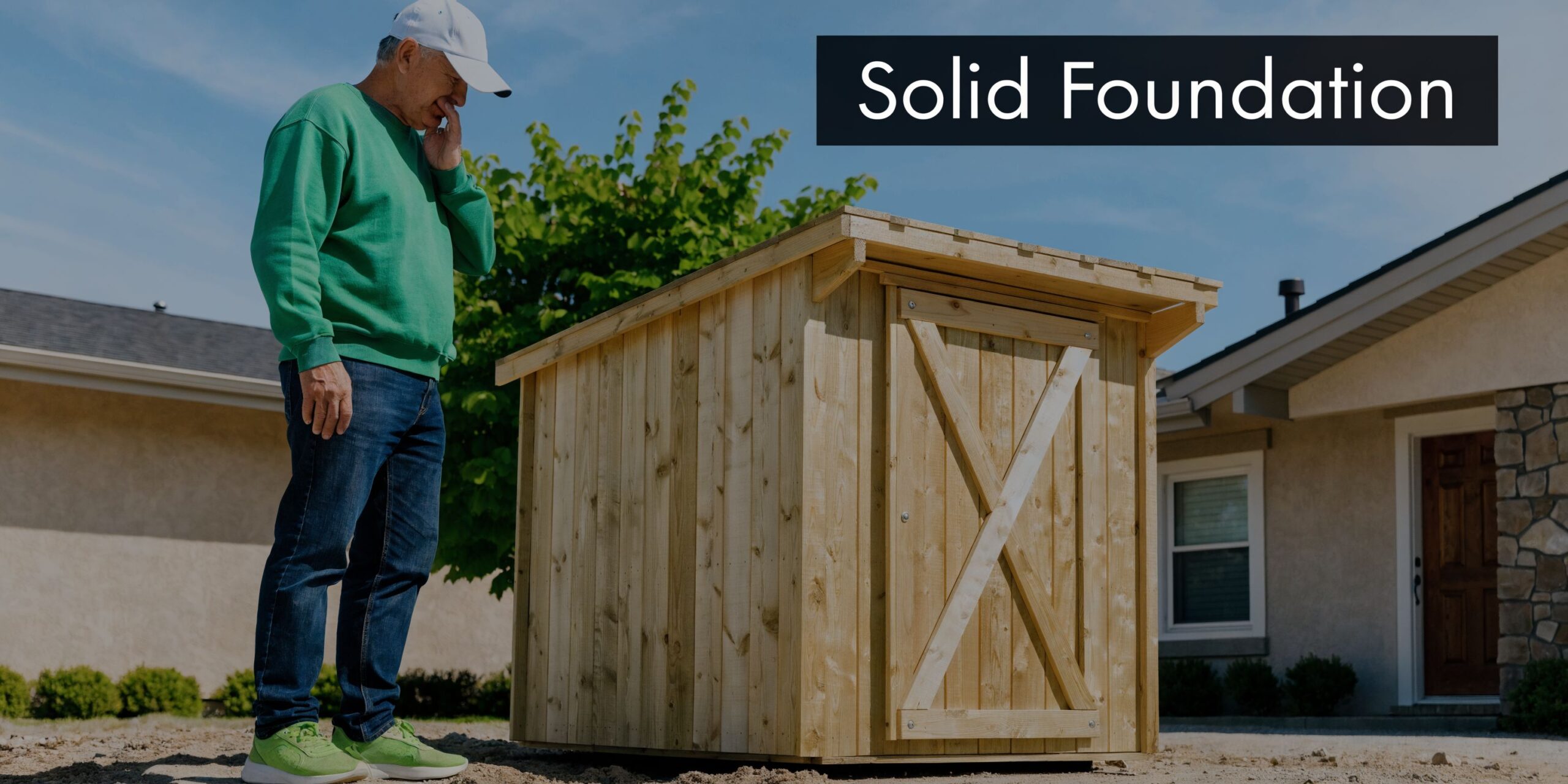 Pressure Treated Plywood Shed Floor Guide for PA & NJ 2 An elderly man in a green sweatshirt inspects a newly built wooden shed in a backyard.